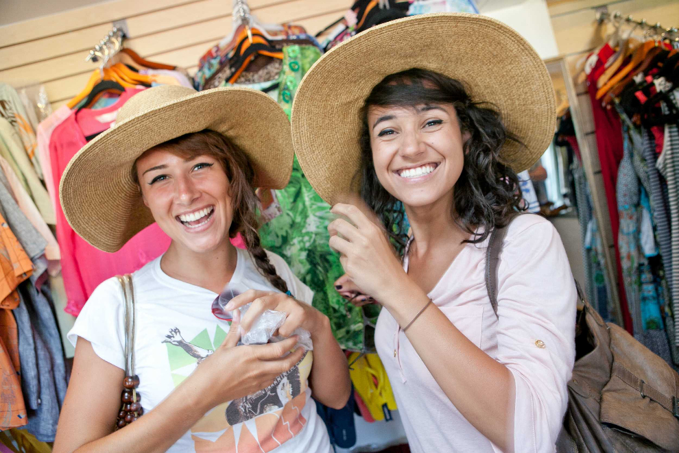 Visitors browsing woven hats and local fashion in Jamaica