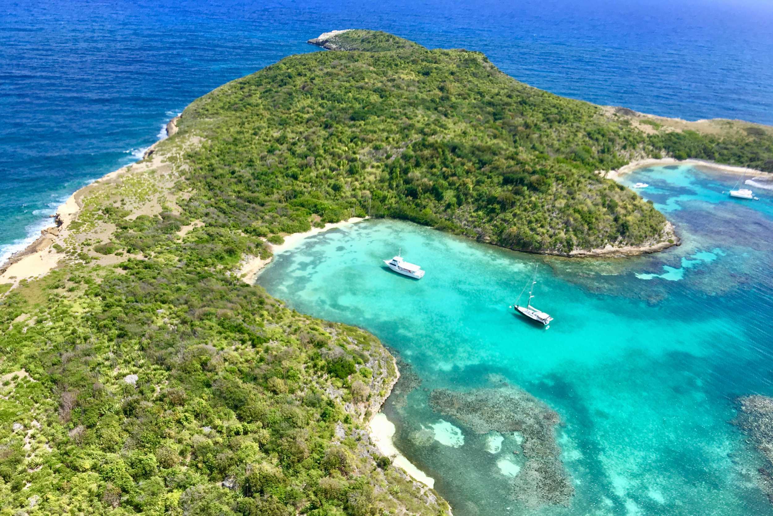 Aerial view of Great Bird Island and its turquoise coves in Antigua