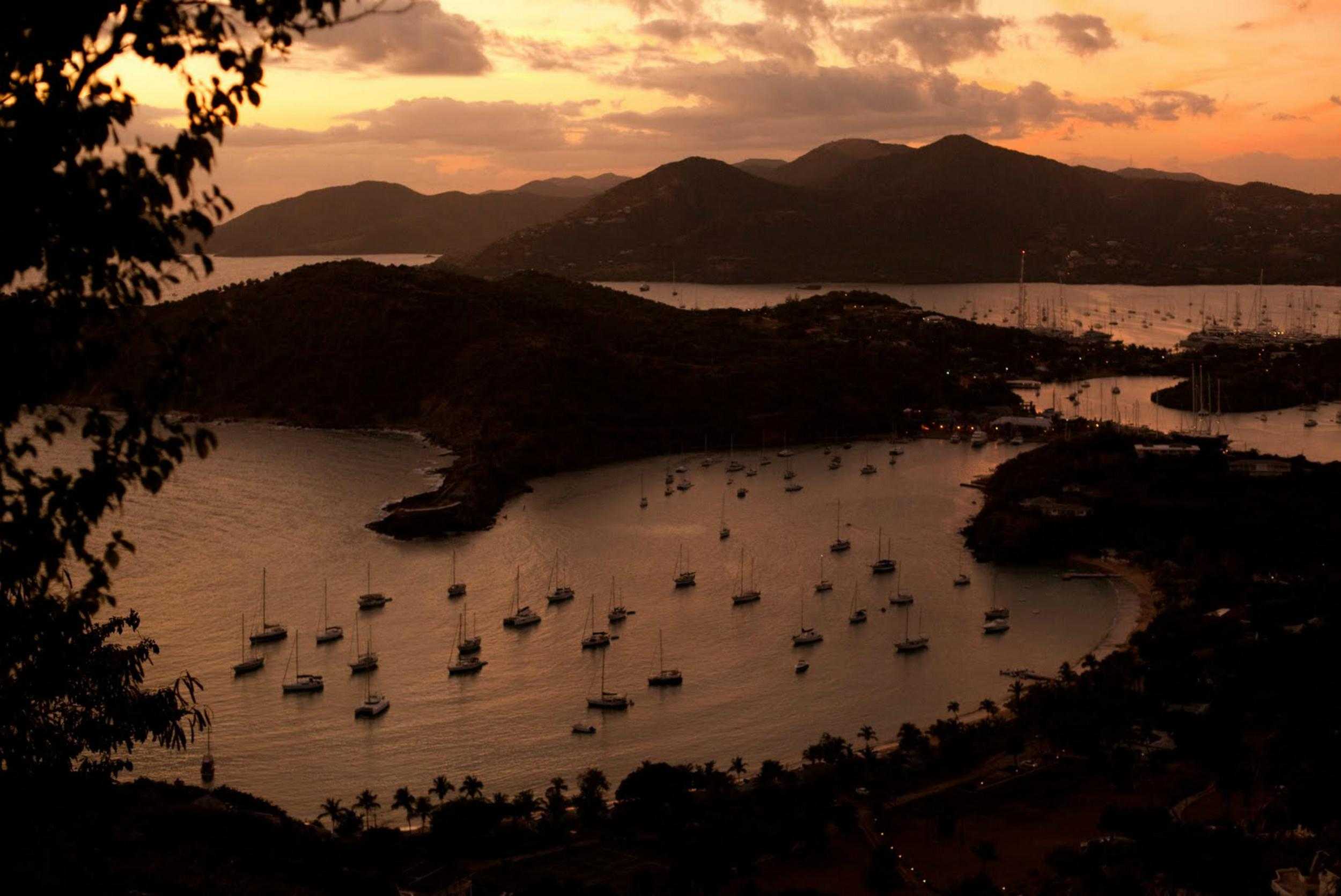 Sunset over English Harbour and anchored sailboats in Antigua
